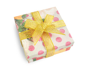 Gift box (present) with festive floral (flower) and polka dot prints, golden ribbon bow, isolated on white