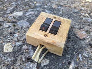old light switch with two switches on the street