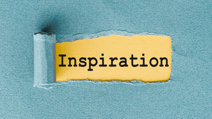 INSPIRATION words written under ripped and torn paper.