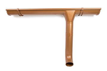 Contemporary bronze color metal rainwater downpipe on white background, isolated.