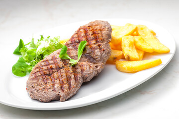 beef steak with homemade french fries and vegetable salad