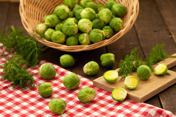 Fresh brussel sprouts in wicker basket. Green, healthy vegetables, vegan food.
