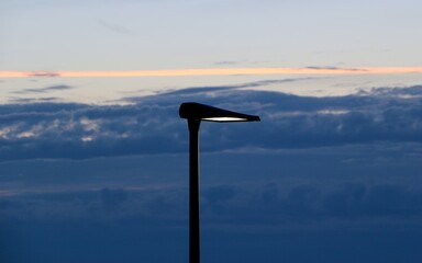 Isolated head of an led powered street lamp post at dusk 