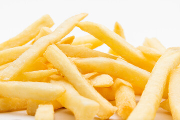 Fried potato chips isolated on white.