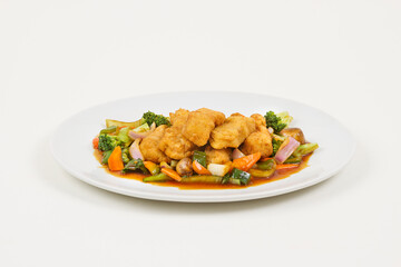 Chinese food with fried chicken and vegetables.