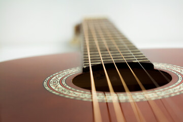 Fototapeta premium Classical guitar close up, classical guitar fretboard on white background
