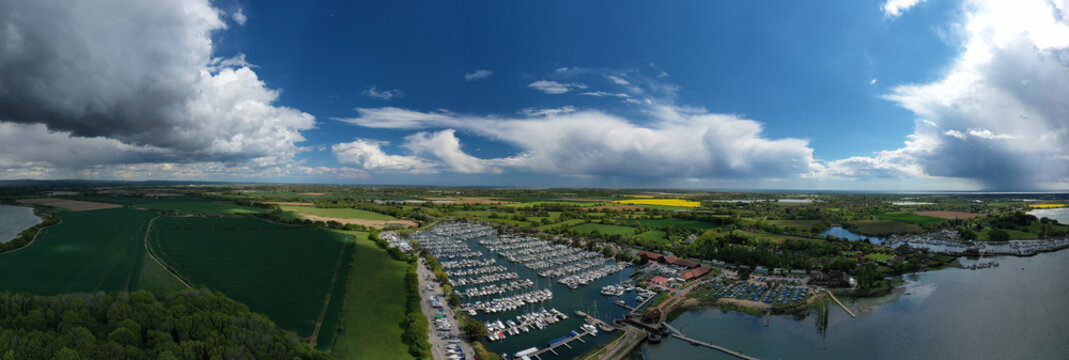 Aerial panoramic photo of Chichester Marina full of yachts and boats in the beautiful countryside of West Sussex in Southern England,