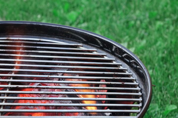 Kettle Grill Pit With Flaming Charcoal. BBQ Hot Grill Close Up. Barbecue Kettle Grill On The Summer...