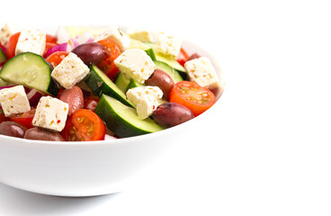 Bowl of Fresh Greek Salad with Cucumbers Tomatoes Olives and Feta Cheese