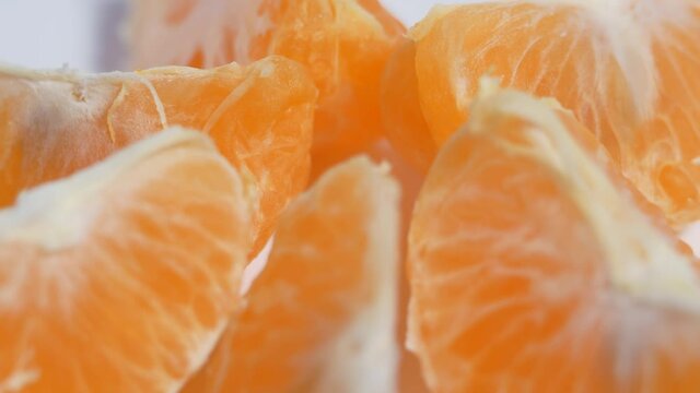 Tangerine slices on a rotating table.