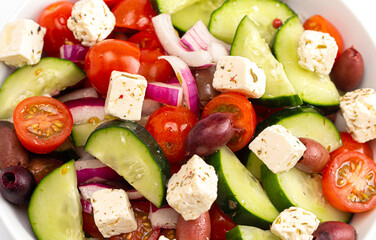 Bowl of Fresh Greek Salad with Cucumbers Tomatoes Olives and Feta Cheese
