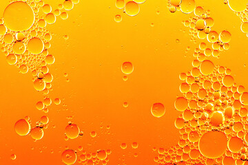Oil circles on the water. Yellow  abstract full frame background.