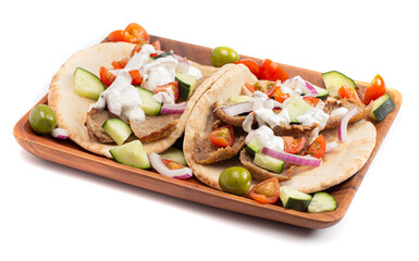 A Gyro with Vegetables and Garlic White Sauce on a White Background