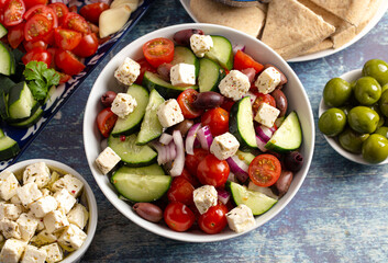 Bowl of Fresh Greek Salad with Cucumbers Tomatoes Olives and Feta Cheese