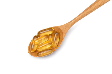 Fish oil top view. Wooden spoon with Omega 3 pills isolated on white background.