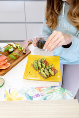 Close up shot of a hands of a young girl preparing a healthy breakfast.