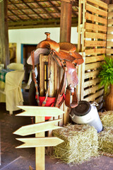 country farm decor with milk drums horse saddle hay palletes with space for text