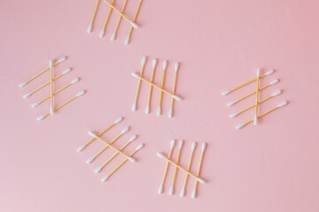 environmentally friendly bamboo and cotton cotton buds on a pink background, bamboo toothbrushes for adults and children. human personal hygiene products without harming the environment, biodegradable