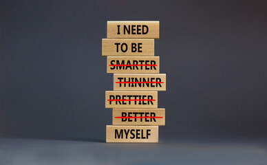 Be myself symbol. Businessman hand. Wooden blocks with words 'i need to be myself, not smarter,...