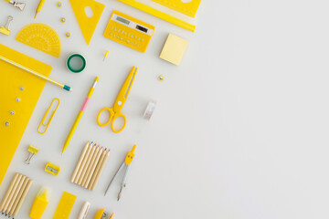 School stationery on a grey background. Top view. Flat lay. Back to school concept.
