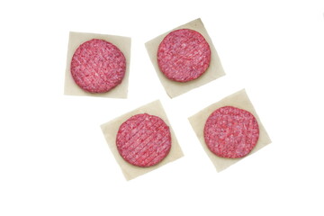 Raw Minced Steak Burgers from Beef and Pork Meat Isolated on White Background, Overhead View. Uncooked Round Patties for Grilling from Ground Beef And Pork. Homemade Burgers For BBQ Grill, Top View.