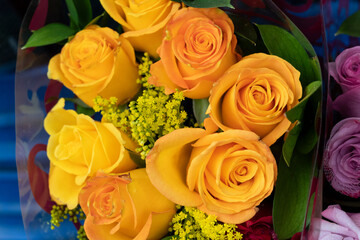 Closeup to a yellow and pink roses  bouquet at floewrshop