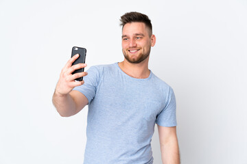 Russian handsome man over isolated background making a selfie