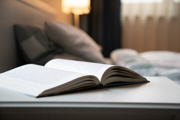 cozy bedroom detail focus on open book