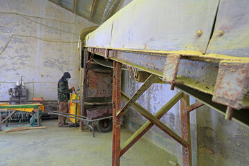 Workers in the fertilizer bagging production line busy in a fertilizer plant