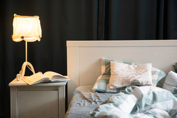 cozy bedroom detail with night lamp