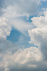 blue sky with storm clouds approaching on a hot and humid spring day