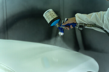 Workshop personnel paint the car with the utmost care. Madrid.