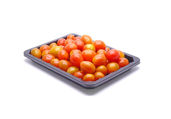 Cherry tomatoes in black plastic package isolated on white background