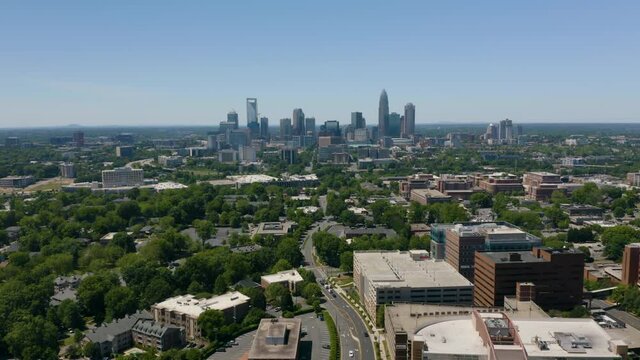 Drone Flies Toward Downtown Charlotte, North Carolina on Hot Summer Day