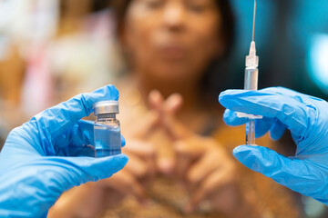 patient indian old senior woman does not agree to put the vaccine in clinic in india.Vaccine...