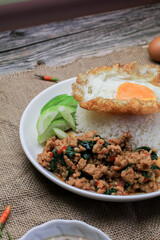 Thai Stir fried  basil with minced pork, chili and fried egg on topped rice. Thai local food style...
