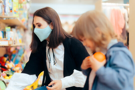 Mother and Toddler Daughter Shopping for Toys in a Store