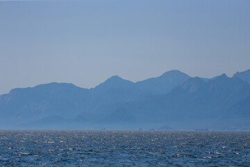 View of the mediterranean sea against the backdrop of high taurus mountains
