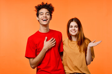 Obraz premium funny guy and girl in multicolored t-shirts modern style fashion