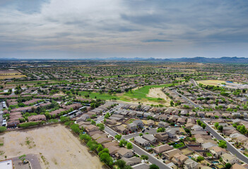 Aerial view in the sleeping area with the road over Avondale small town in AZ USA