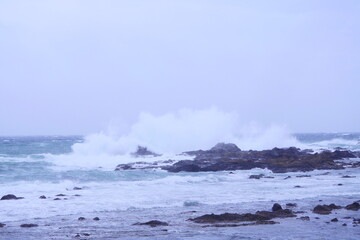 waves crashing on rocks
