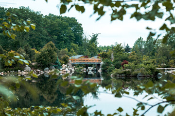 Fototapeta na wymiar Landscape of the bridge in the japanese garden at the Frederik Meijer Gardens