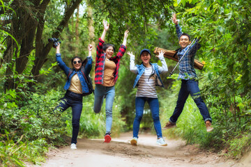 Asian friends group enjoy hiking on vacation.