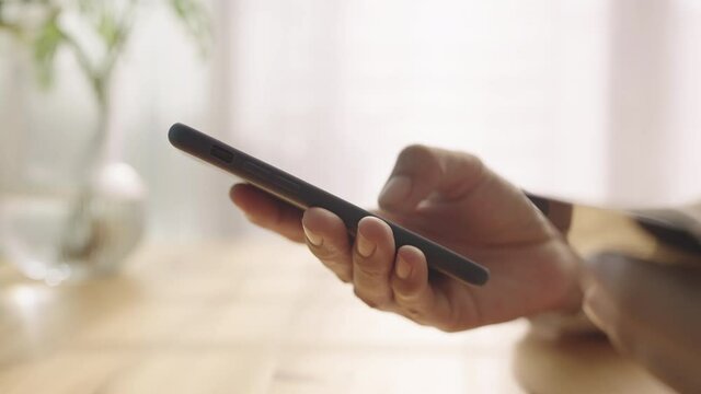 Hand of Asian women are buying online with a credit card on smartphone