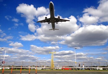 Jet Aircraft Soars Over Road Moments Before Landing at Airport
