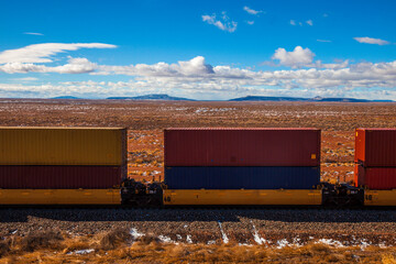 Freight rail cars being hauled in the Southwest