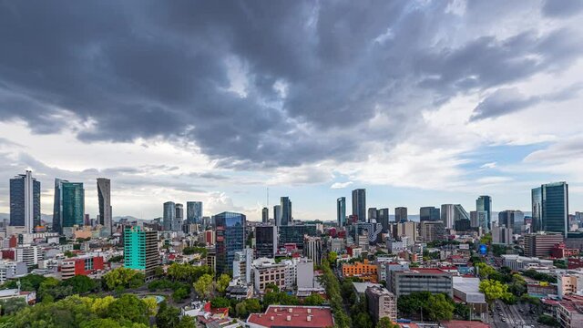 Timelapse of the business and financial district of Mexico City, with skyscrapers and the cityscape of Paseo de la Reforma and Insurgentes avenue, during the sunset