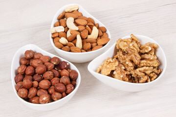 Various nuts and almonds as source healthy natural vitamins and minerals, nutritious eating