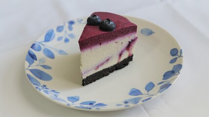 piece of cheesecake with fresh  blueberry