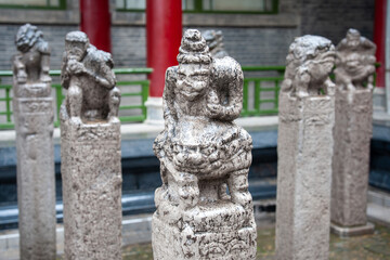 Naklejka premium Chinese statues. Unusual sculptures in close-up.